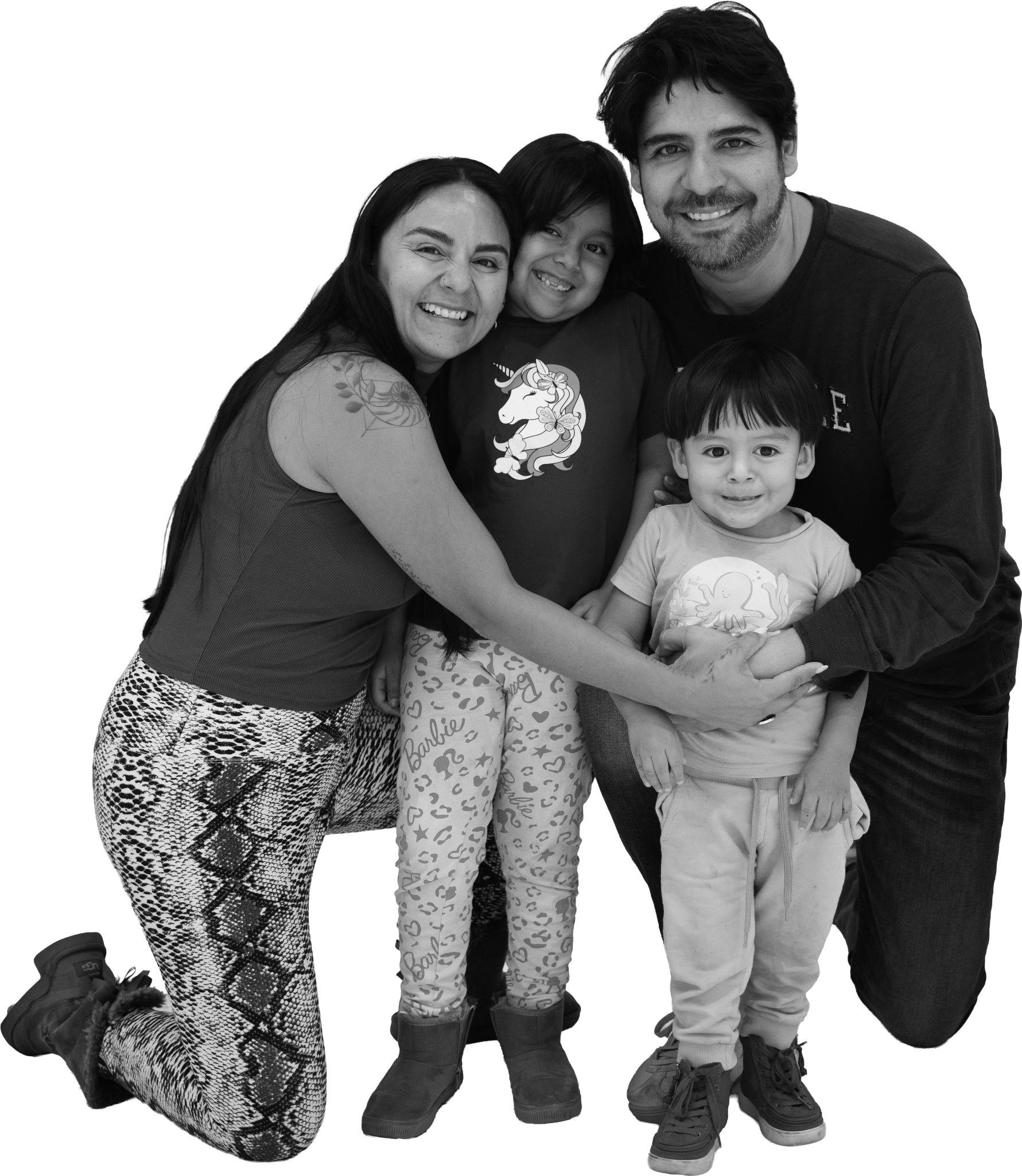 Black-and-white portrait of a family of four embracing